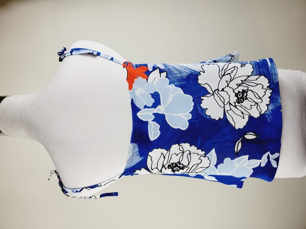 Cotton Tank Top featuring a blue floral sleeveless design with white and light blue flowers, crafted from premium quality cotton, displayed on a dress form against a plain background. This boho tank top comes with adjustable straps.