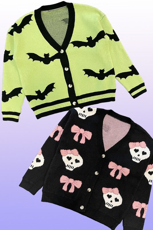 An exclusive in-house design, the PLUS SIZE Halloween knit cardigan features black bat intarsia patterns, black trim, and a black button closure on a lime green background. Set against a gradient backdrop transitioning from light purple at the top to blue at the bottom, this piece offers added comfort and style for plus sizes.