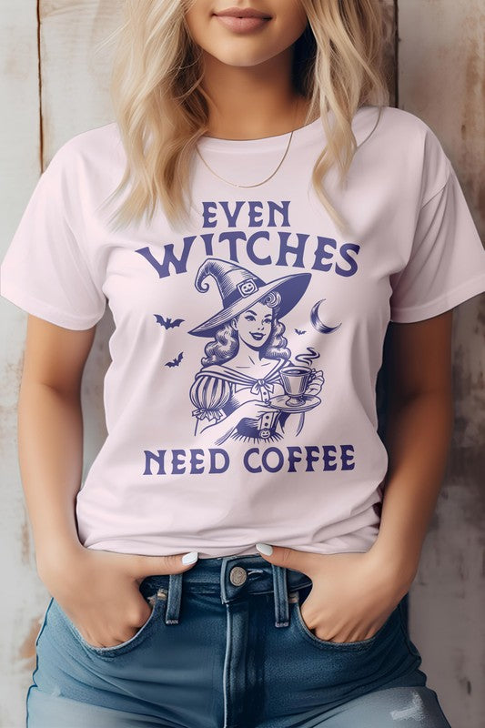 A woman wears the "Even Witches Need Coffee" Halloween Graphic Tee, featuring a witch design and playful purple text. This gray t-shirt, crafted from eco-friendly materials, combines style with a hint of witch magic.