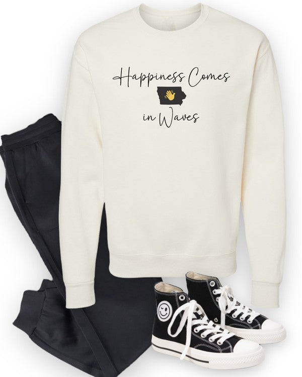 A person wearing the "Happiness Comes in Waves Cozy Sweatshirt," which features an illustration of a wave and a sun along with the text, effortlessly combines comfort and style. The unisex garment pairs perfectly with the person's long hair and orange-painted nails.