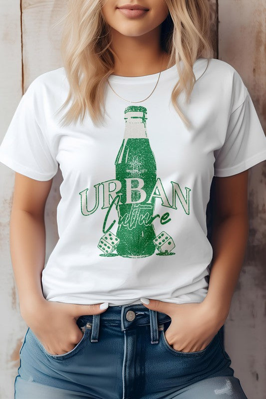 A person wearing the Urban Culture Street Graphic Tee in light green, featuring a vintage Coca-Cola bottle design, stands with hands in jeans pockets.