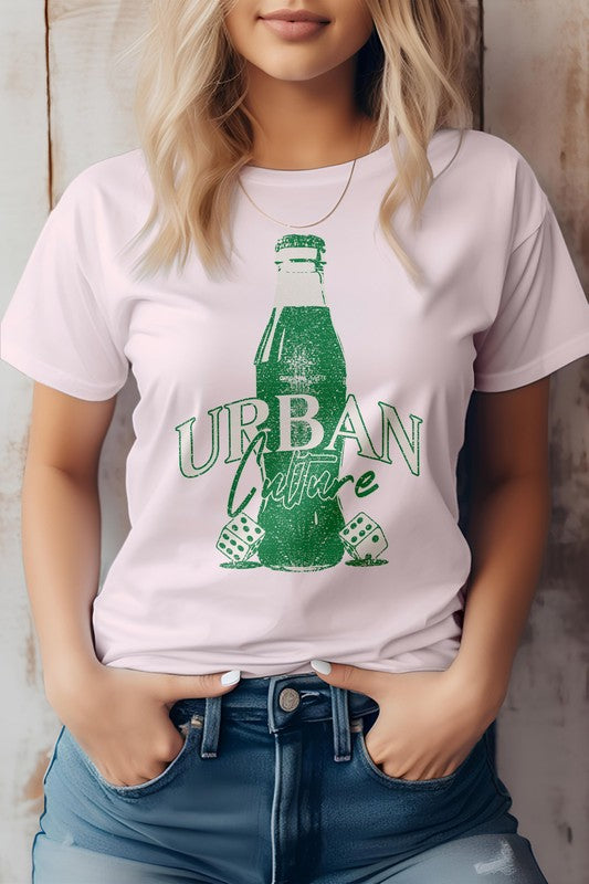 A person wearing the Urban Culture Street Graphic Tee in light green, featuring a vintage Coca-Cola bottle design, stands with hands in jeans pockets.