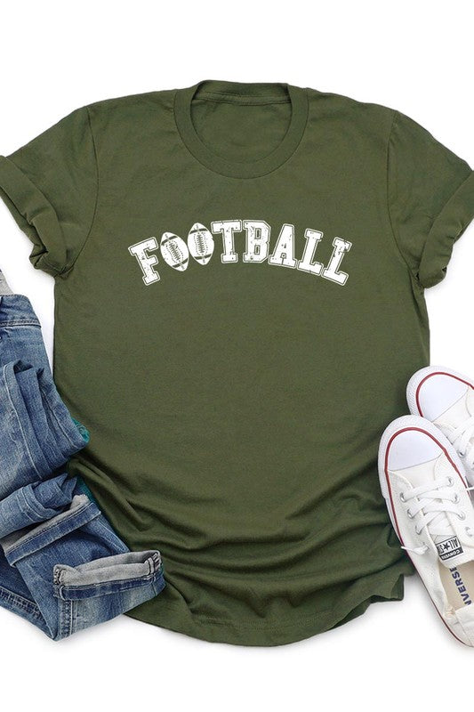 The Football Graphic Tee in beige features "FOOTBALL" in black lettering, paired with light blue distressed denim shorts and a pair of sunglasses. Crafted from premium materials for maximum comfort and style, this unisex crew neck short sleeve shirt is perfect for casual outings.