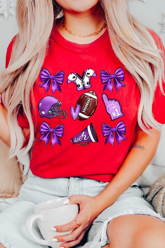 Someone wearing a Purple Coquette Football Graphic Tee, a unisex crew neck pink t-shirt decorated with sports-themed illustrations like a football, helmet, megaphone, foam finger, and cheerleading accessories in purple and white.