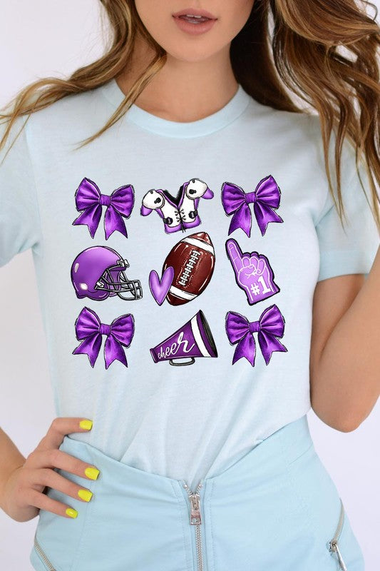 Someone wearing a Purple Coquette Football Graphic Tee, a unisex crew neck pink t-shirt decorated with sports-themed illustrations like a football, helmet, megaphone, foam finger, and cheerleading accessories in purple and white.