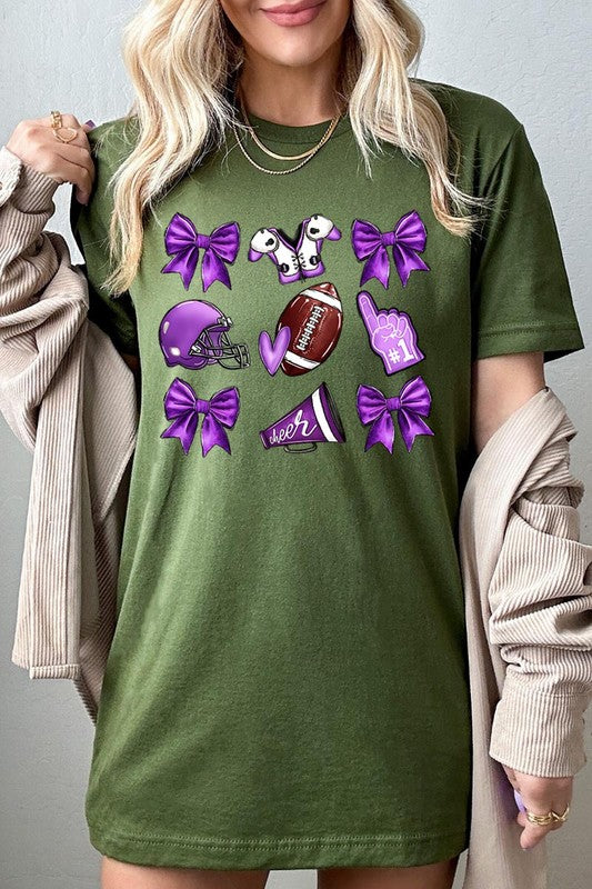 Someone wearing a Purple Coquette Football Graphic Tee, a unisex crew neck pink t-shirt decorated with sports-themed illustrations like a football, helmet, megaphone, foam finger, and cheerleading accessories in purple and white.