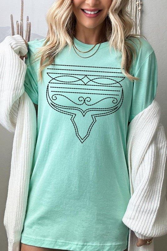 A person wearing the Western Boot Stitch Graphic Tee, featuring a geometric design and holding the bottom of the shirt, has a denim jacket draped over their shoulders.