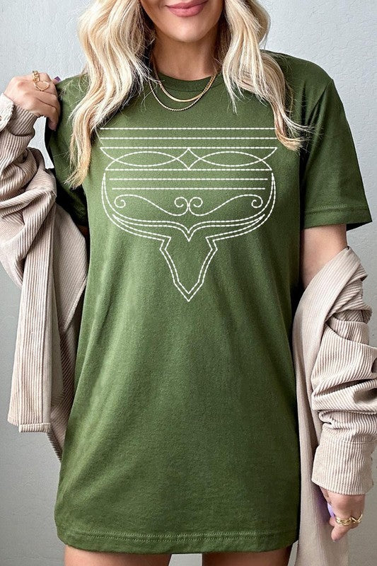 A person wearing the Western Boot Stitch Graphic Tee, featuring a geometric design and holding the bottom of the shirt, has a denim jacket draped over their shoulders.