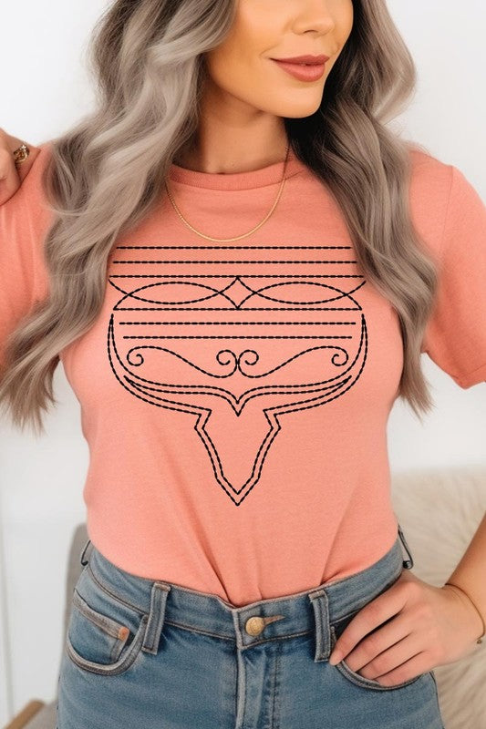 A person wearing the Western Boot Stitch Graphic Tee, featuring a geometric design and holding the bottom of the shirt, has a denim jacket draped over their shoulders.