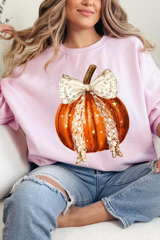 A person wearing the Coquette bow Halloween Pumpkin Fleece Sweatshirt, which features a black unisex crew neck design with a printed Halloween pumpkin graphic adorned with a large, lacy white bow.