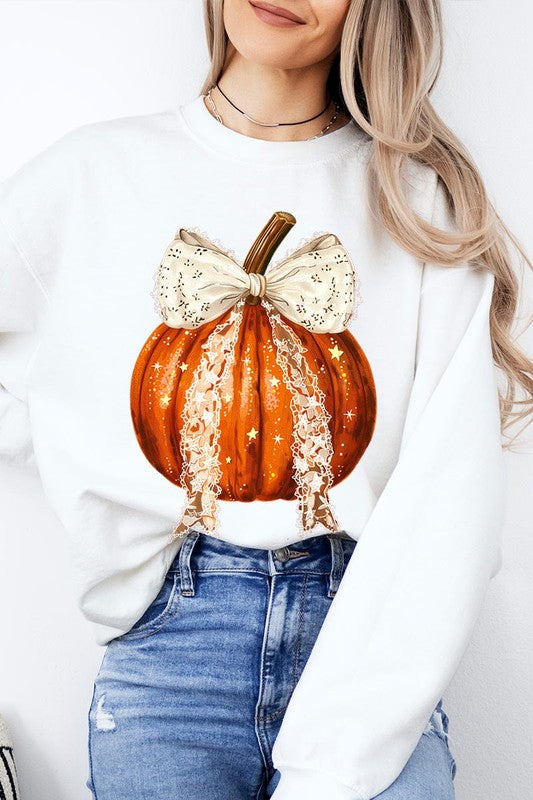 A person wearing the Coquette bow Halloween Pumpkin Fleece Sweatshirt, which features a black unisex crew neck design with a printed Halloween pumpkin graphic adorned with a large, lacy white bow.