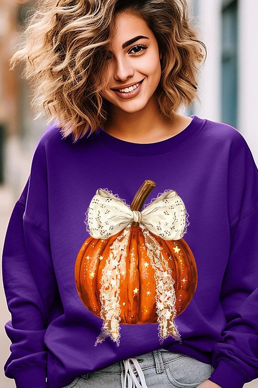 A person wearing the Coquette bow Halloween Pumpkin Fleece Sweatshirt, which features a black unisex crew neck design with a printed Halloween pumpkin graphic adorned with a large, lacy white bow.