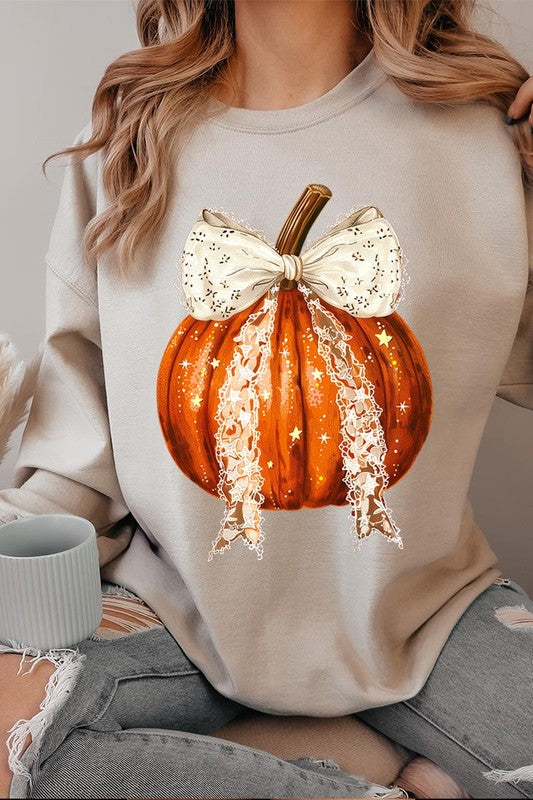 A person wearing the Coquette bow Halloween Pumpkin Fleece Sweatshirt, which features a black unisex crew neck design with a printed Halloween pumpkin graphic adorned with a large, lacy white bow.