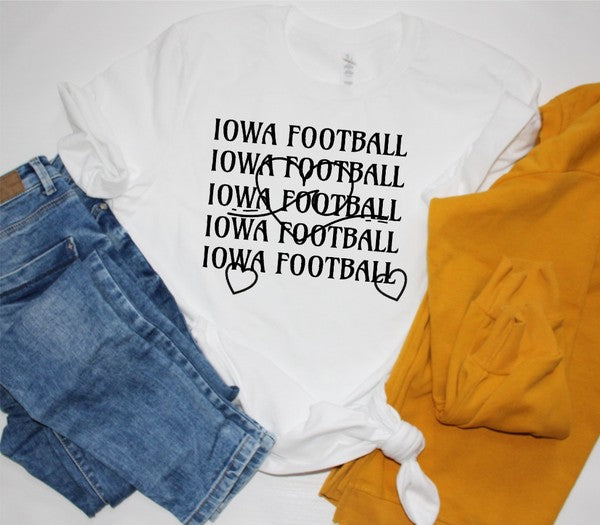 Person standing with hands on hips wearing an Iowa Football Wave Heart Graphic Crew Tee and black shorts.