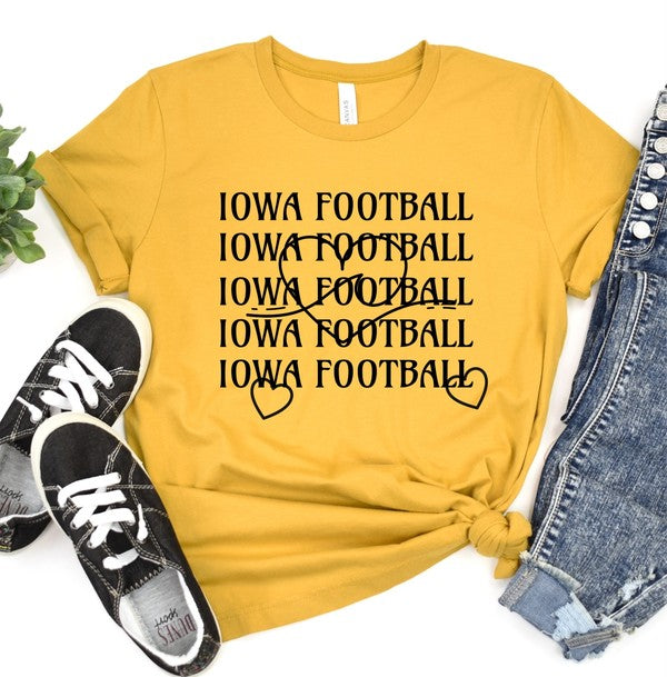 Person standing with hands on hips wearing an Iowa Football Wave Heart Graphic Crew Tee and black shorts.