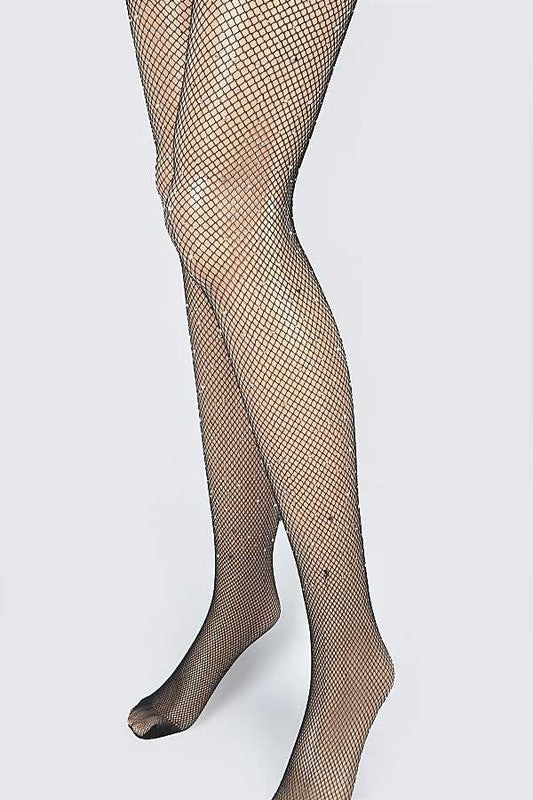 Close-up of a person wearing the Rhinestone Accent Fishnet Stocking, standing against a plain white background.