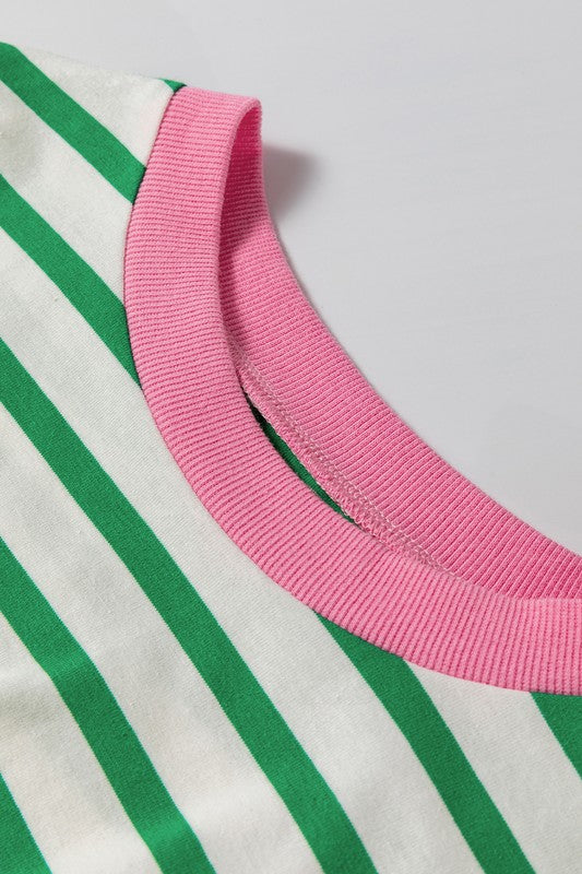 A person wearing the Cotton Stripe Drop Shoulder Sweatshirt, which features green stripes and pink cuffs, is facing away from the camera against a pink background.