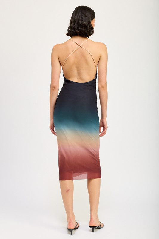 A woman wearing a small HALTER NECK OMBRE MAXI DRESS crafted from a blend of polyester and spandex stands against a plain background, pairing it perfectly with black sandals.