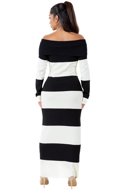 A woman wearing a WOMEN FASHION LONG MAXI KNIT DRESS, an off-the-shoulder, body-con maxi dress with black and white stripes, stands against a plain background.