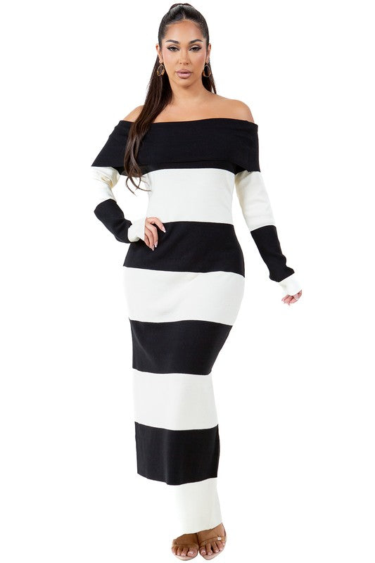 A woman wearing a WOMEN FASHION LONG MAXI KNIT DRESS, an off-the-shoulder, body-con maxi dress with black and white stripes, stands against a plain background.