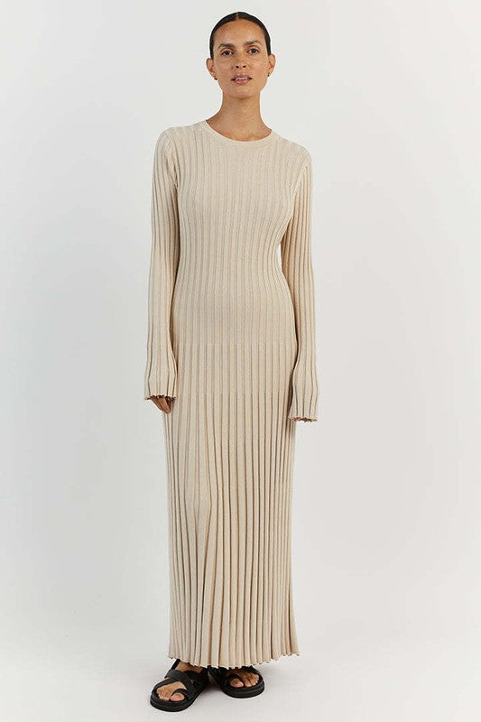 A woman is wearing a WOMEN FASHION KNITWEAR LONG MAXI DRESS, featuring long sleeves, a black ribbed texture, and a round neckline, standing against a plain background.