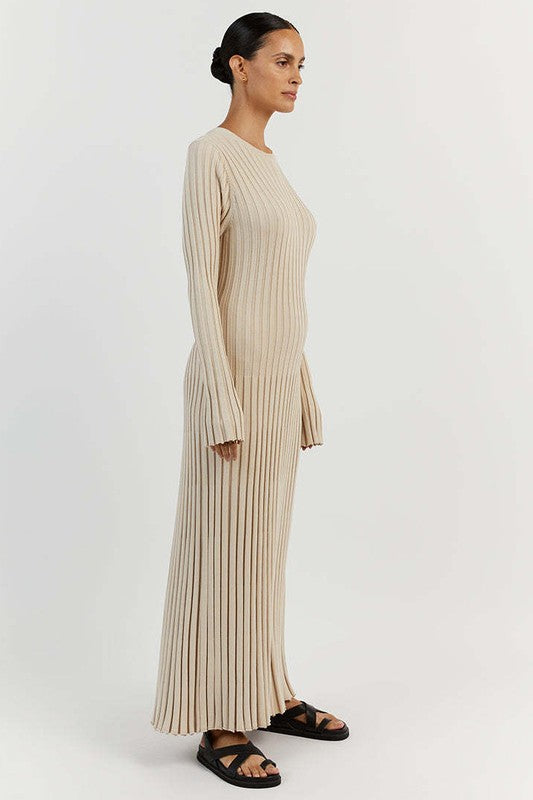 A woman is wearing a WOMEN FASHION KNITWEAR LONG MAXI DRESS, featuring long sleeves, a black ribbed texture, and a round neckline, standing against a plain background.