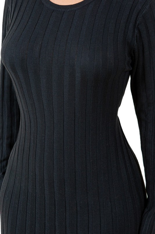 A woman is wearing a WOMEN FASHION KNITWEAR LONG MAXI DRESS, featuring long sleeves, a black ribbed texture, and a round neckline, standing against a plain background.