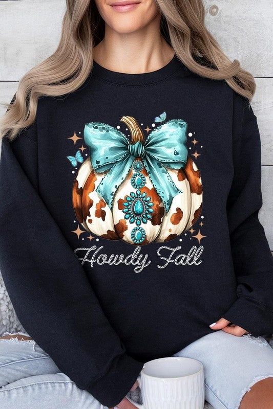 Person wearing a light gray sweatshirt with a decorative pumpkin design featuring a teal bow and the text "Howdy Fall." This stylish piece is part of our Howdy Fall Western Pumpkin Fleece Sweatshirts collection, perfect for anyone looking for unisex crew neck sweaters this season.