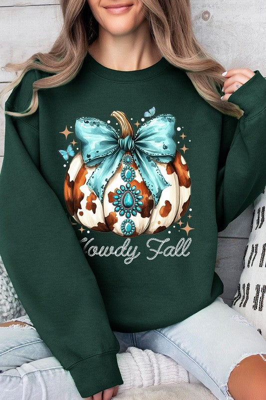 Person wearing a light gray sweatshirt with a decorative pumpkin design featuring a teal bow and the text "Howdy Fall." This stylish piece is part of our Howdy Fall Western Pumpkin Fleece Sweatshirts collection, perfect for anyone looking for unisex crew neck sweaters this season.