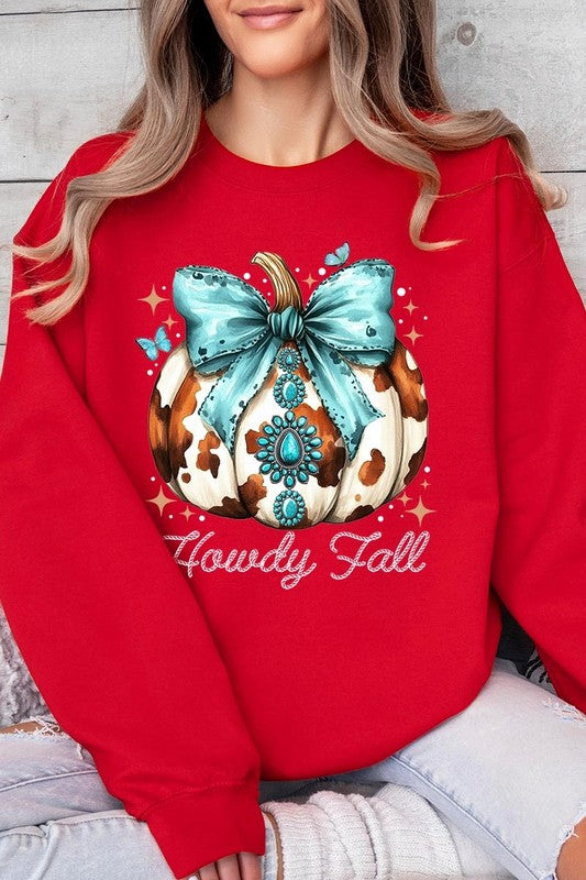 Person wearing a light gray sweatshirt with a decorative pumpkin design featuring a teal bow and the text "Howdy Fall." This stylish piece is part of our Howdy Fall Western Pumpkin Fleece Sweatshirts collection, perfect for anyone looking for unisex crew neck sweaters this season.