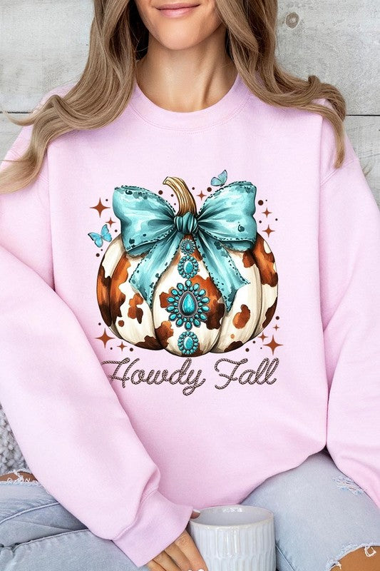 Person wearing a light gray sweatshirt with a decorative pumpkin design featuring a teal bow and the text "Howdy Fall." This stylish piece is part of our Howdy Fall Western Pumpkin Fleece Sweatshirts collection, perfect for anyone looking for unisex crew neck sweaters this season.