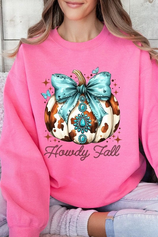 Person wearing a light gray sweatshirt with a decorative pumpkin design featuring a teal bow and the text "Howdy Fall." This stylish piece is part of our Howdy Fall Western Pumpkin Fleece Sweatshirts collection, perfect for anyone looking for unisex crew neck sweaters this season.