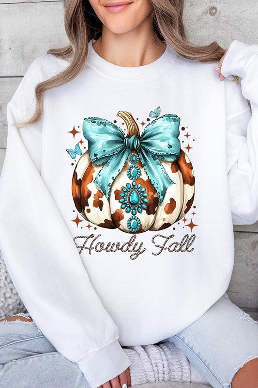 Person wearing a light gray sweatshirt with a decorative pumpkin design featuring a teal bow and the text "Howdy Fall." This stylish piece is part of our Howdy Fall Western Pumpkin Fleece Sweatshirts collection, perfect for anyone looking for unisex crew neck sweaters this season.