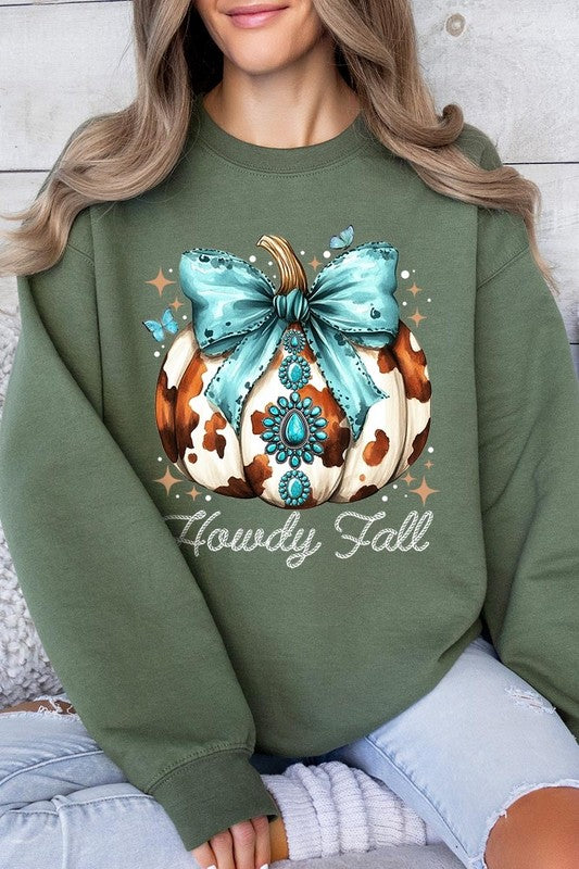 Person wearing a light gray sweatshirt with a decorative pumpkin design featuring a teal bow and the text "Howdy Fall." This stylish piece is part of our Howdy Fall Western Pumpkin Fleece Sweatshirts collection, perfect for anyone looking for unisex crew neck sweaters this season.