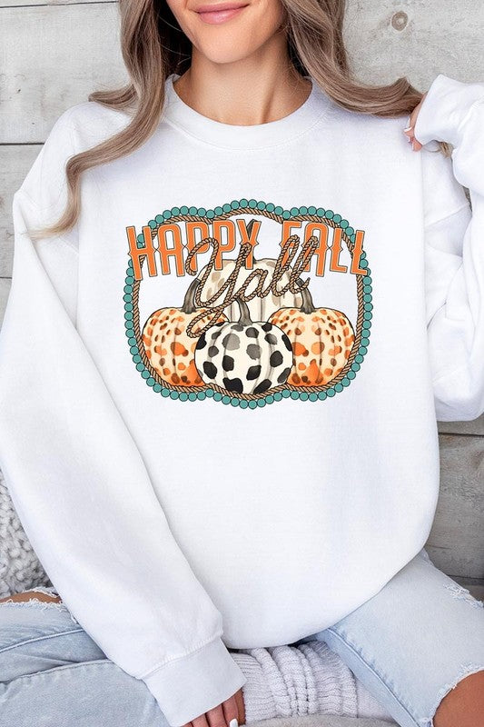 Woman wearing a green "Happy Fall Y'all" Graphic Fleece Sweatshirt featuring three patterned pumpkins printed on the front.