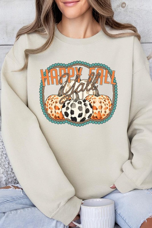 Woman wearing a green "Happy Fall Y'all" Graphic Fleece Sweatshirt featuring three patterned pumpkins printed on the front.