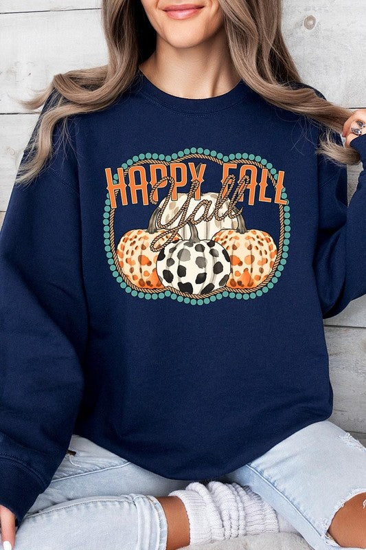 Woman wearing a green "Happy Fall Y'all" Graphic Fleece Sweatshirt featuring three patterned pumpkins printed on the front.