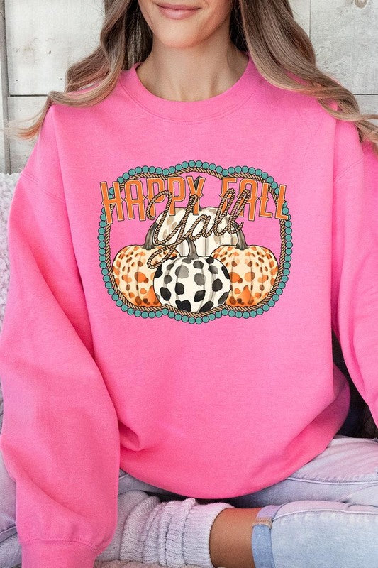 Woman wearing a green "Happy Fall Y'all" Graphic Fleece Sweatshirt featuring three patterned pumpkins printed on the front.