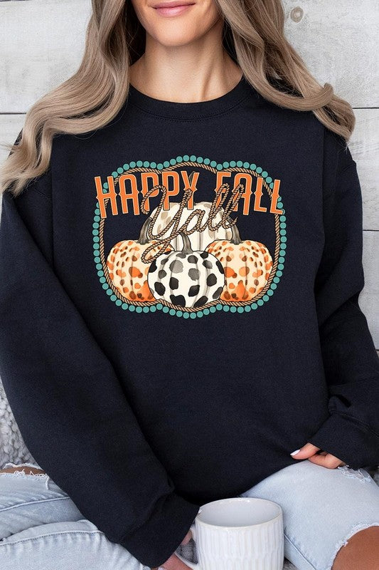 Woman wearing a green "Happy Fall Y'all" Graphic Fleece Sweatshirt featuring three patterned pumpkins printed on the front.