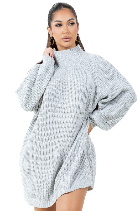 A person models the WOMEN FASHION SWEATER DRESS, a light gray turtleneck sweater dress with long sleeves, paired with tan ankle boots against a plain white background.