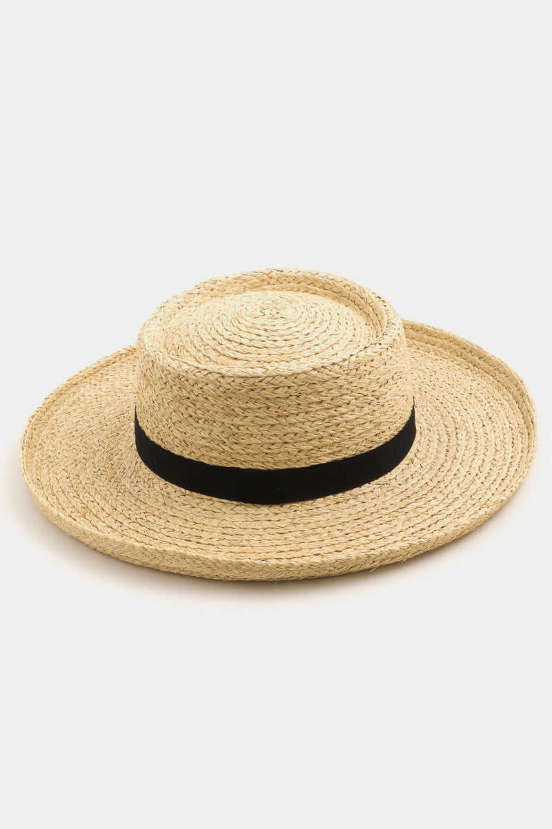 A person smiling in a Fame Wide Brim Straw Weave Hat and a white tank top epitomizes the ideal summer wardrobe against a light background.