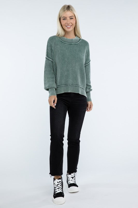 Person wearing a green Washed Side Slit Oversized Cropped Sweater with drop shoulders and black pants, standing against a plain background.