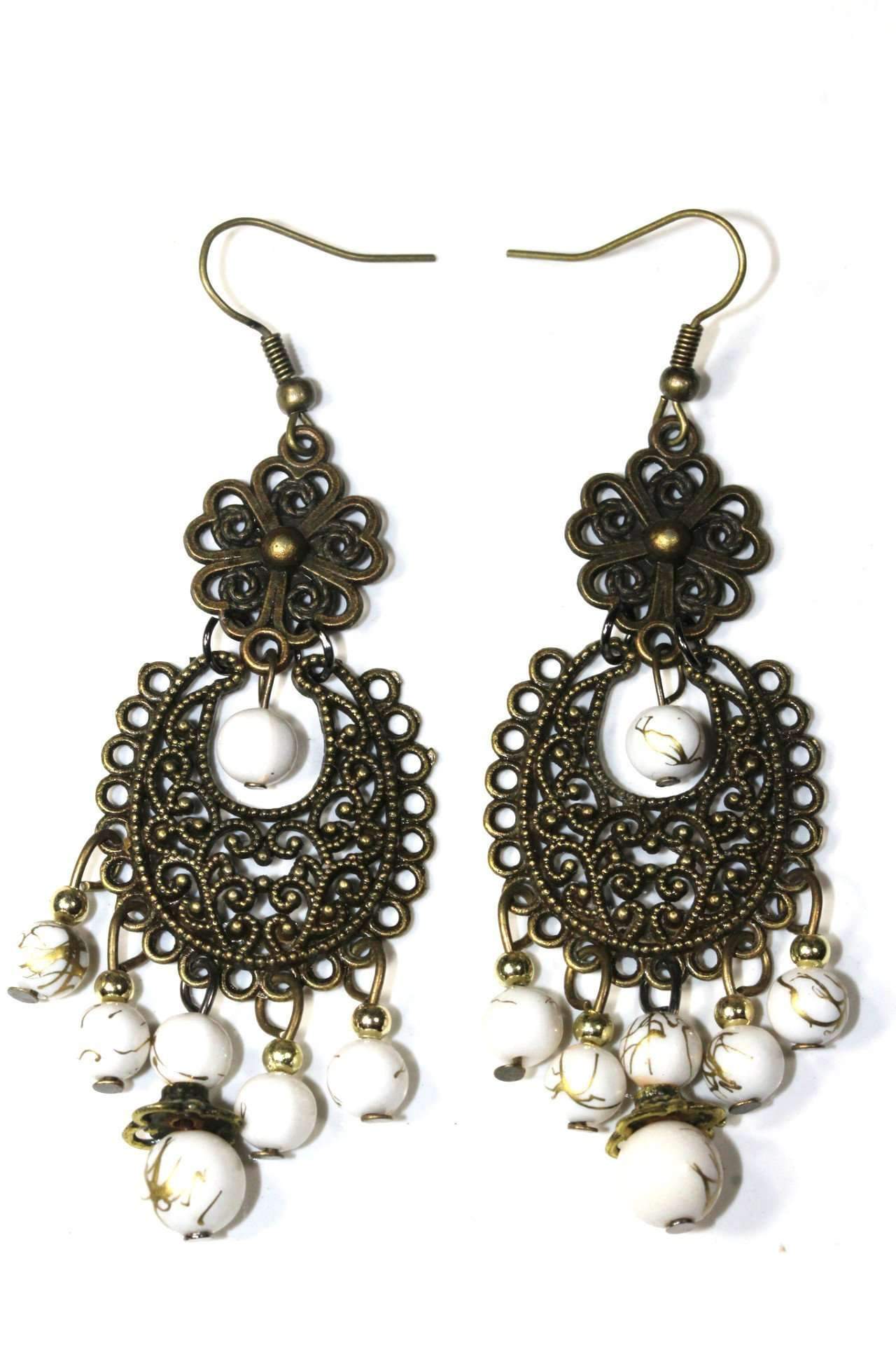 A pair of Grand Boheme Filigree Dangle Earrings with small white bead accents hanging on a white background.