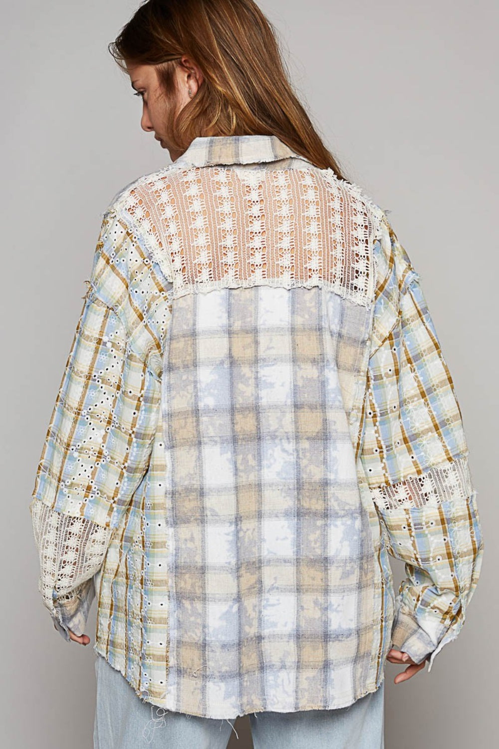 A young woman poses against a plain background, wearing the POL Long Sleeve Embroidered Crochet Plaid Shirt over a white crop top and drawstring light-blue pants.