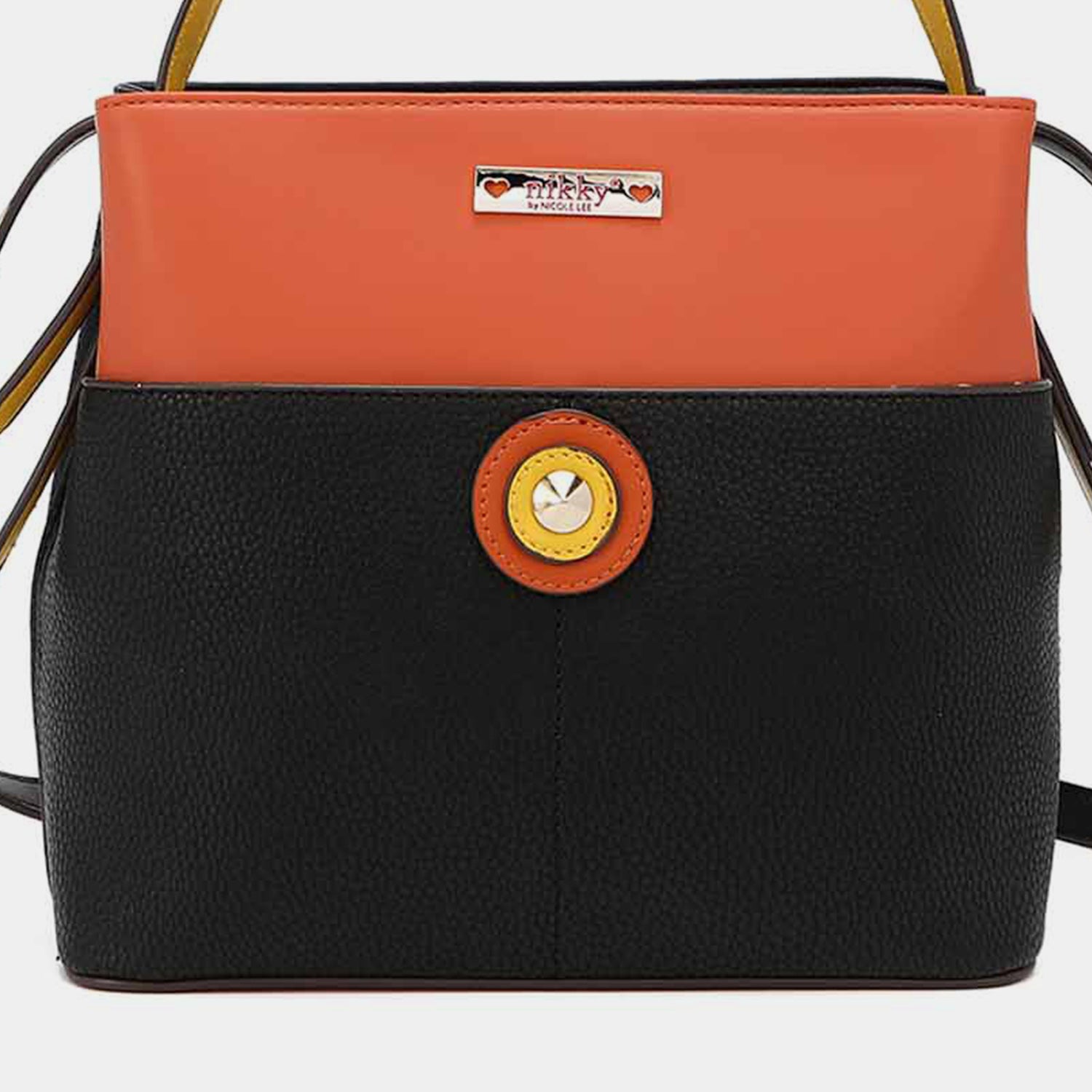 A Nicole Lee USA Contrast Leather Shoulder Bag in black and orange with yellow trim, featuring an adjustable shoulder strap, a circular logo on the front, and a small metal plaque near the top.