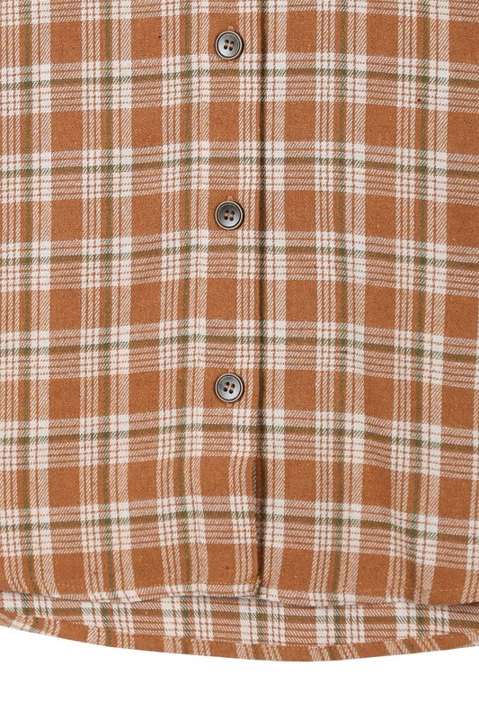 Wearing an Autumn beige plaid shirt, a person with long hair complements their look with hoop earrings, showcasing the season's warm hues. This long-sleeved shirt rests gracefully against a beige backdrop and is ideal for machine wash cold care.