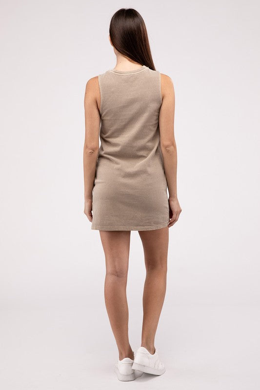 A woman stands in a casual pose, wearing a sleeveless, rust-colored Sleeveless Mini Dress with side pockets in front of a plain light background.