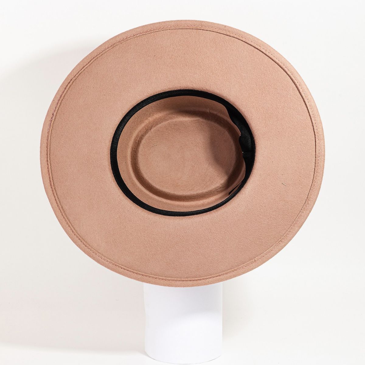 The Fame Flat Brim Strap Pork Pie Hat, featuring a fashionable wide-brimmed tan design accented with a black band, is showcased against a plain white background.