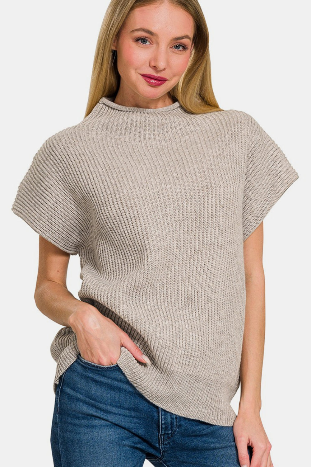 Person wearing a Zenana Short Sleeve Mock Neck Sweater in gray with jeans, standing against a plain background.