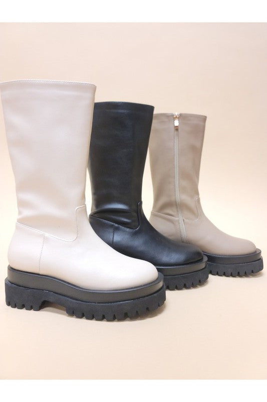 Three pairs of VENET-PLATFORM BOOTS with chunky soles are displayed. The midi length boots come in beige, black, and light beige colors from left to right and feature handy side zippers for easy wear.